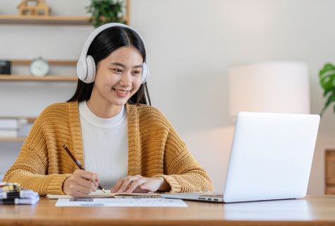 student taking an online test in laptop image